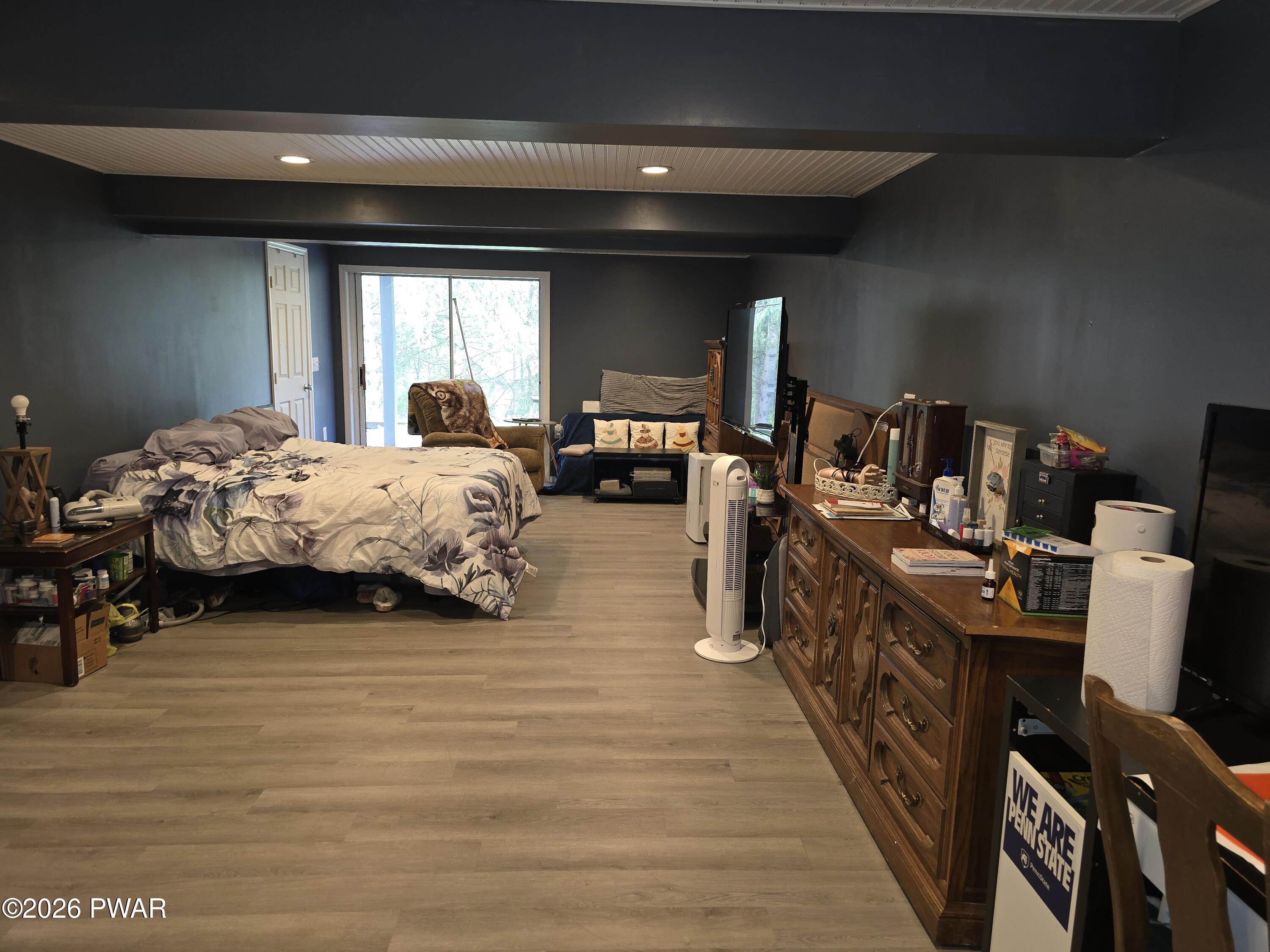 107 Keystone Hls Road, Unit 404 Factoryville, PA 18419 - Photo 22 of 23 a bed room with furniture and a window