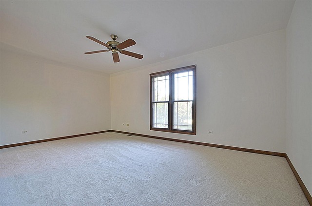 715 Roberts Lane Batavia, IL 60510 - Photo 13 of 24 an empty room with windows and fan