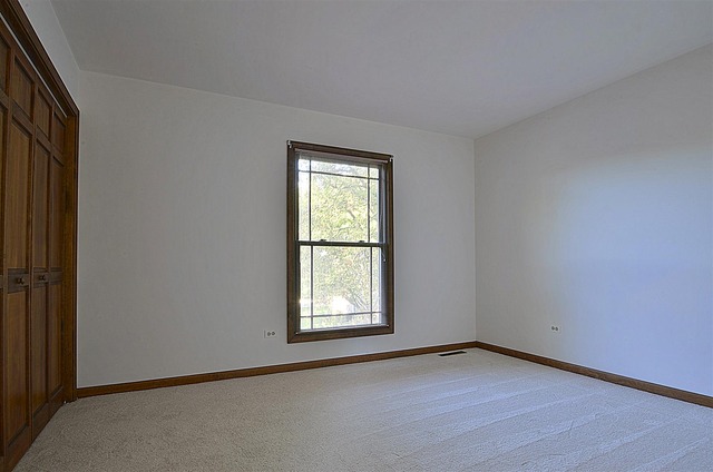 715 Roberts Lane Batavia, IL 60510 - Photo 18 of 24 an empty room with wooden floor and windows