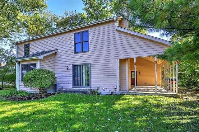 715 Roberts Lane Batavia, IL 60510 - Photo 23 of 24 a front view of a house with garden