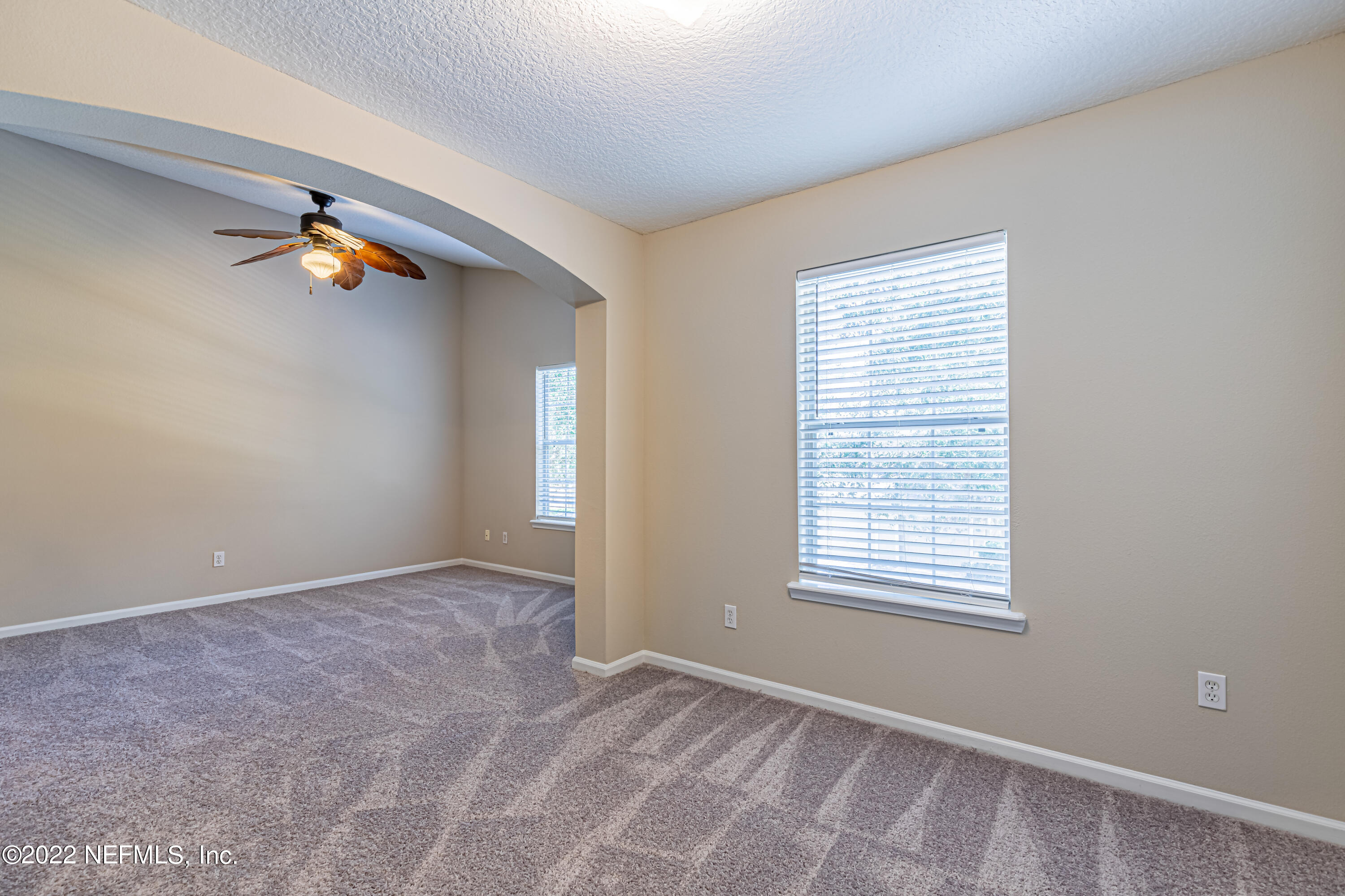 5260 Collins Road, Unit 607 Jacksonville, FL 32244 - Photo 19 of 41 an empty room with windows and a window