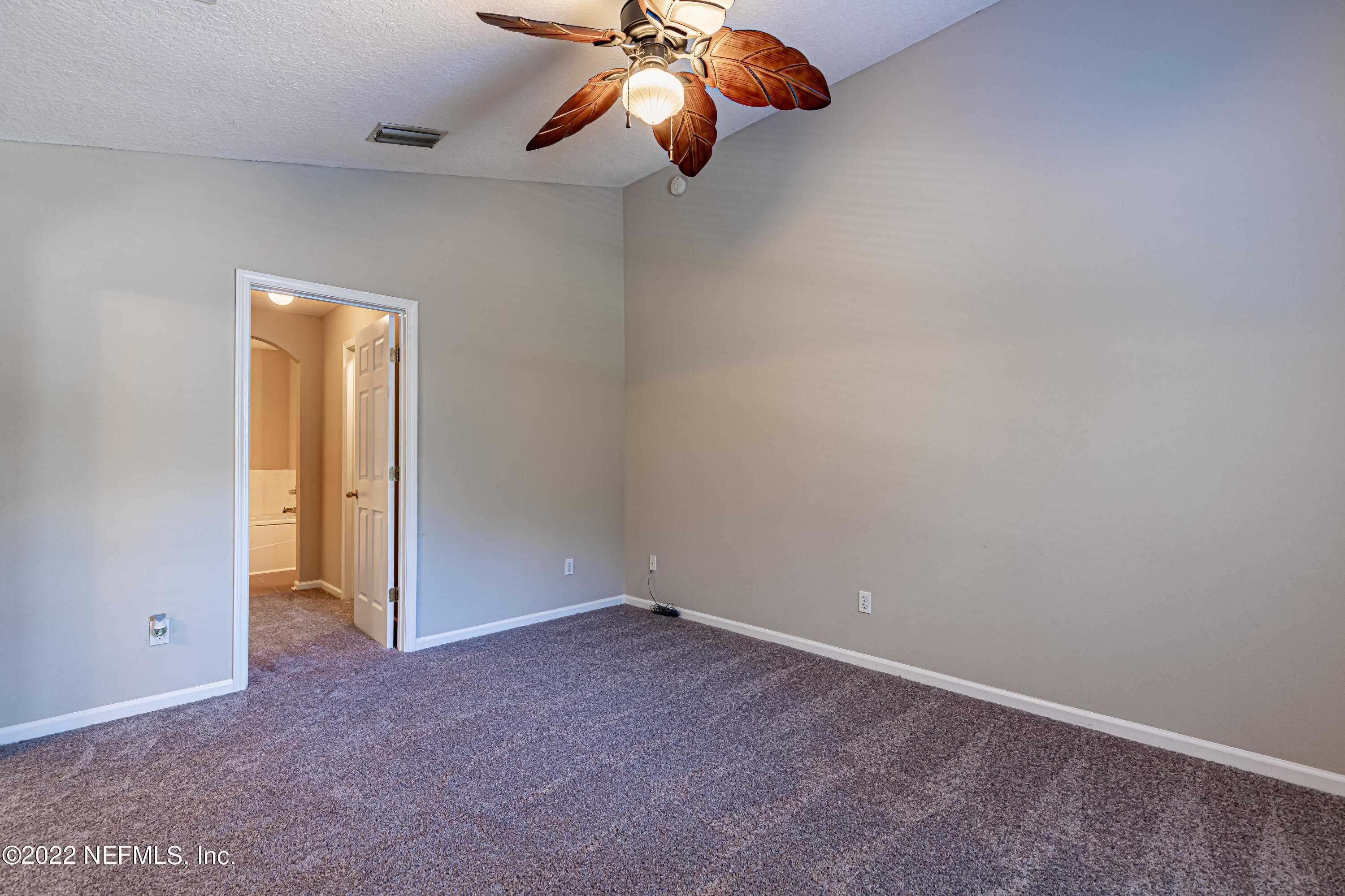 5260 Collins Road, Unit 607 Jacksonville, FL 32244 - Photo 21 of 41 an empty room with closet and windows