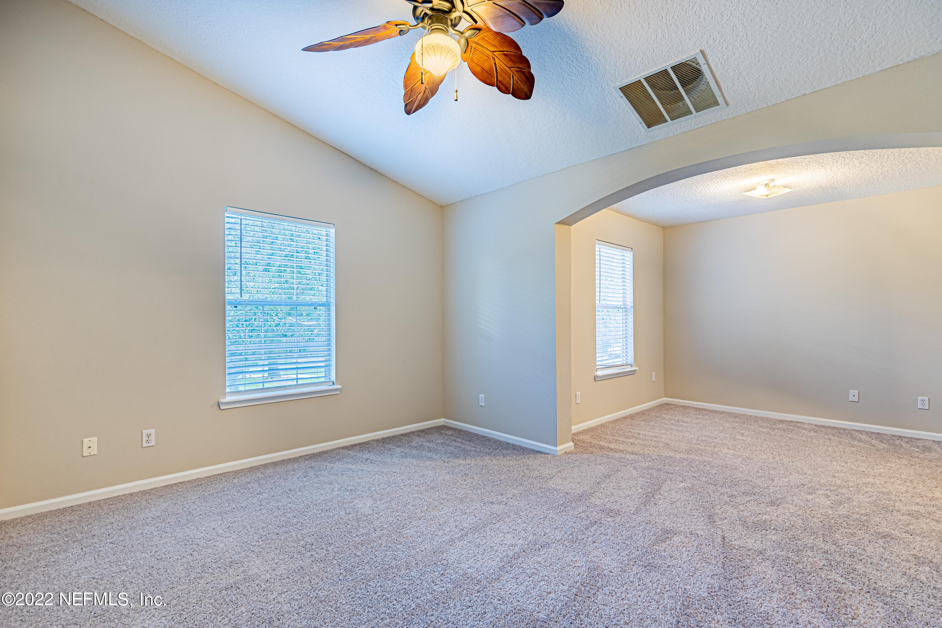 5260 Collins Road, Unit 607 Jacksonville, FL 32244 - Photo 23 of 41 an empty room with windows and fan