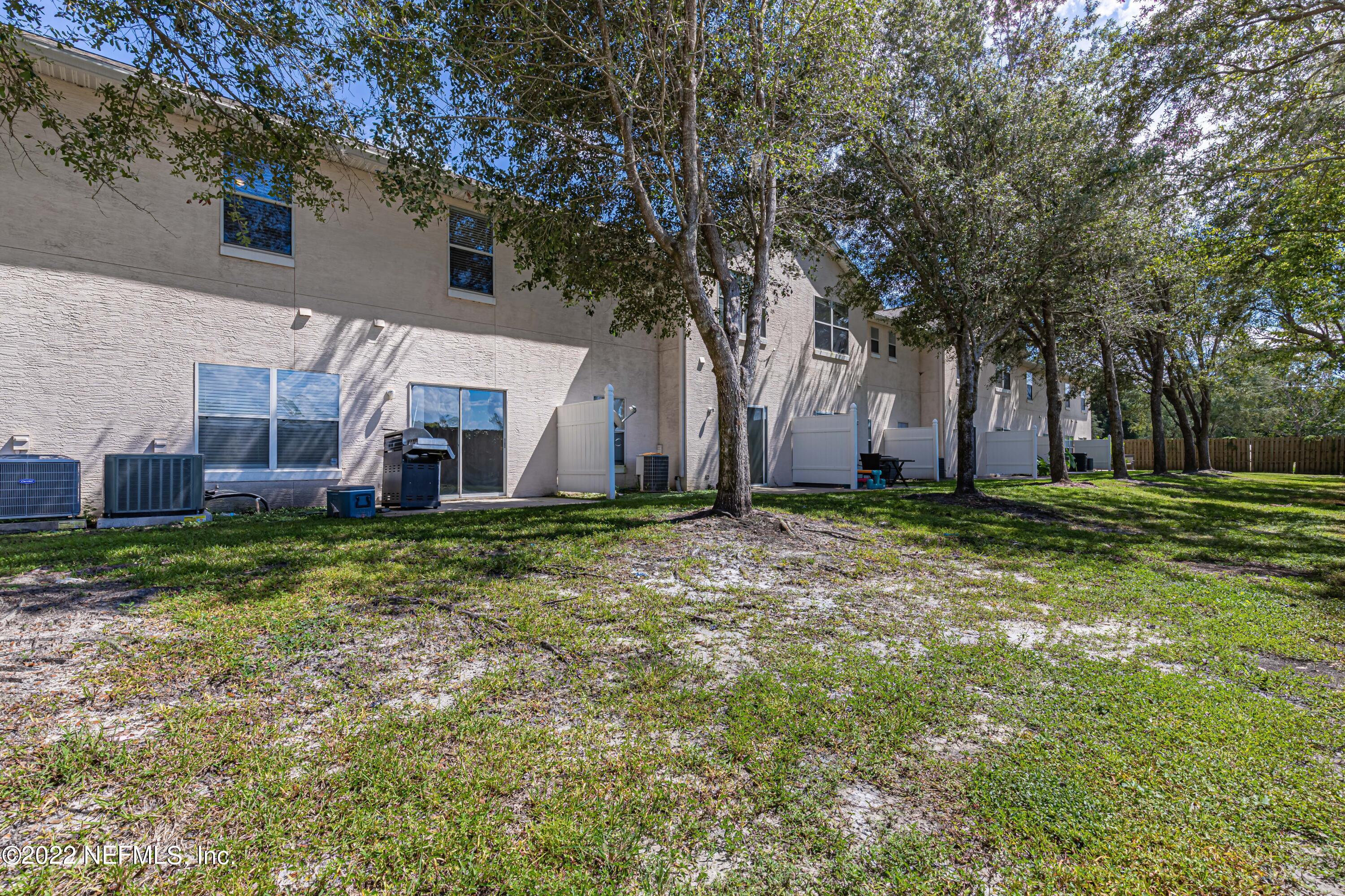 5260 Collins Road, Unit 607 Jacksonville, FL 32244 - Photo 36 of 41 a view of a house with a yard