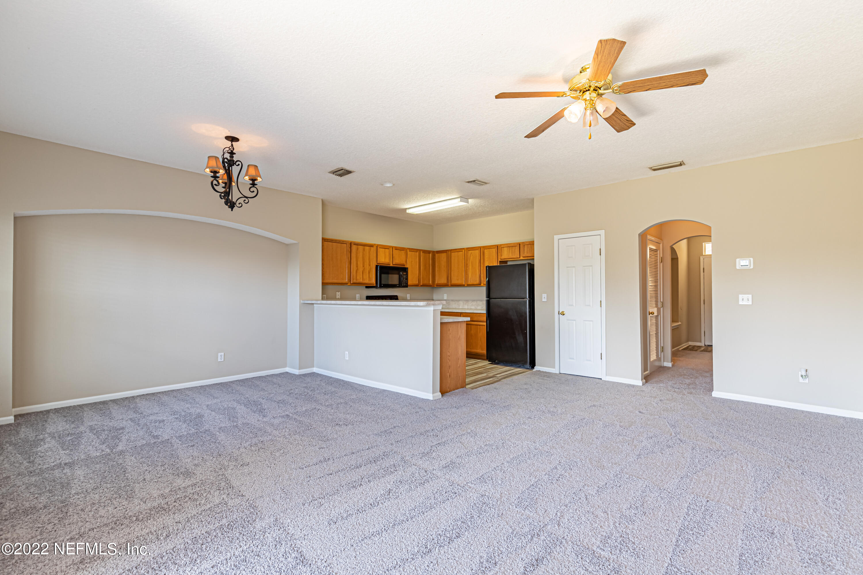 5260 Collins Road, Unit 607 Jacksonville, FL 32244 - Photo 8 of 41 a view of a kitchen with a sink and a kitchen view