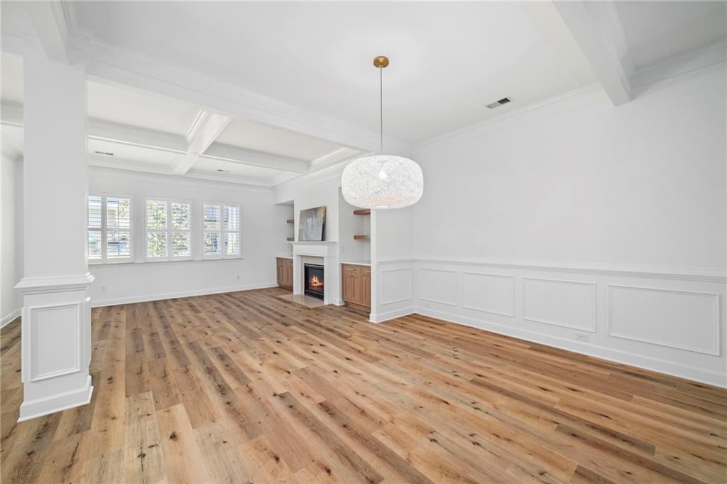 3628 Ashcroft Bend Atlanta, GA 30319 - Photo 10 of 44 a view of an empty room with wooden floor and a window