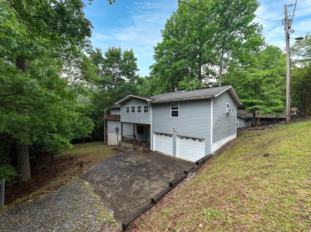 1066 Ridge Road Hiawassee, GA 30546 - Photo 3 of 51 a view of a house with a yard