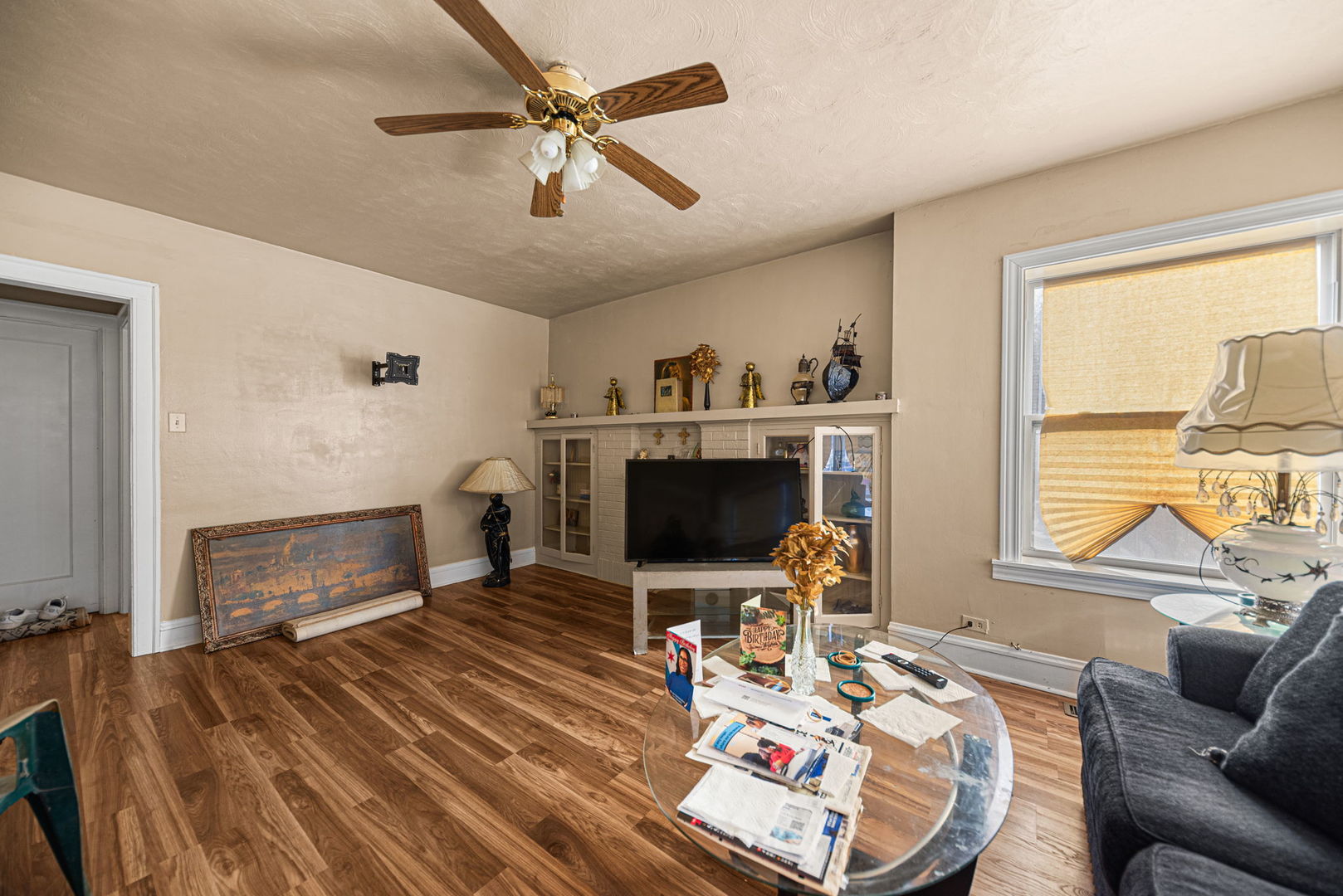 6749 South Peoria Street Chicago, IL 60621 - Photo 16 of 20 a living room with furniture a fireplace and a flat screen tv