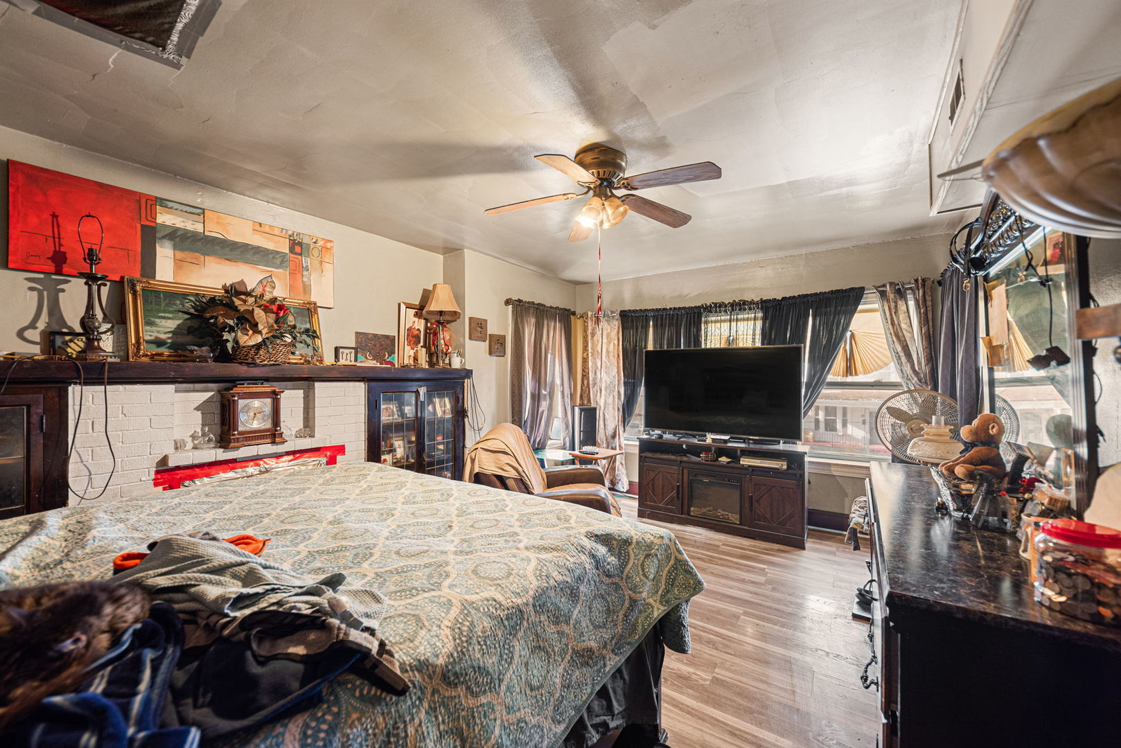 6749 South Peoria Street Chicago, IL 60621 - Photo 9 of 20 a bedroom with a bed and a flat screen tv