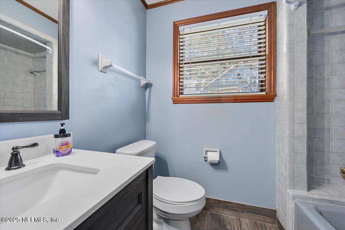 16361 Waterville Road, Unit 1 Jacksonville, FL 32226 - Photo 17 of 32 a bathroom with a sink and a toilet