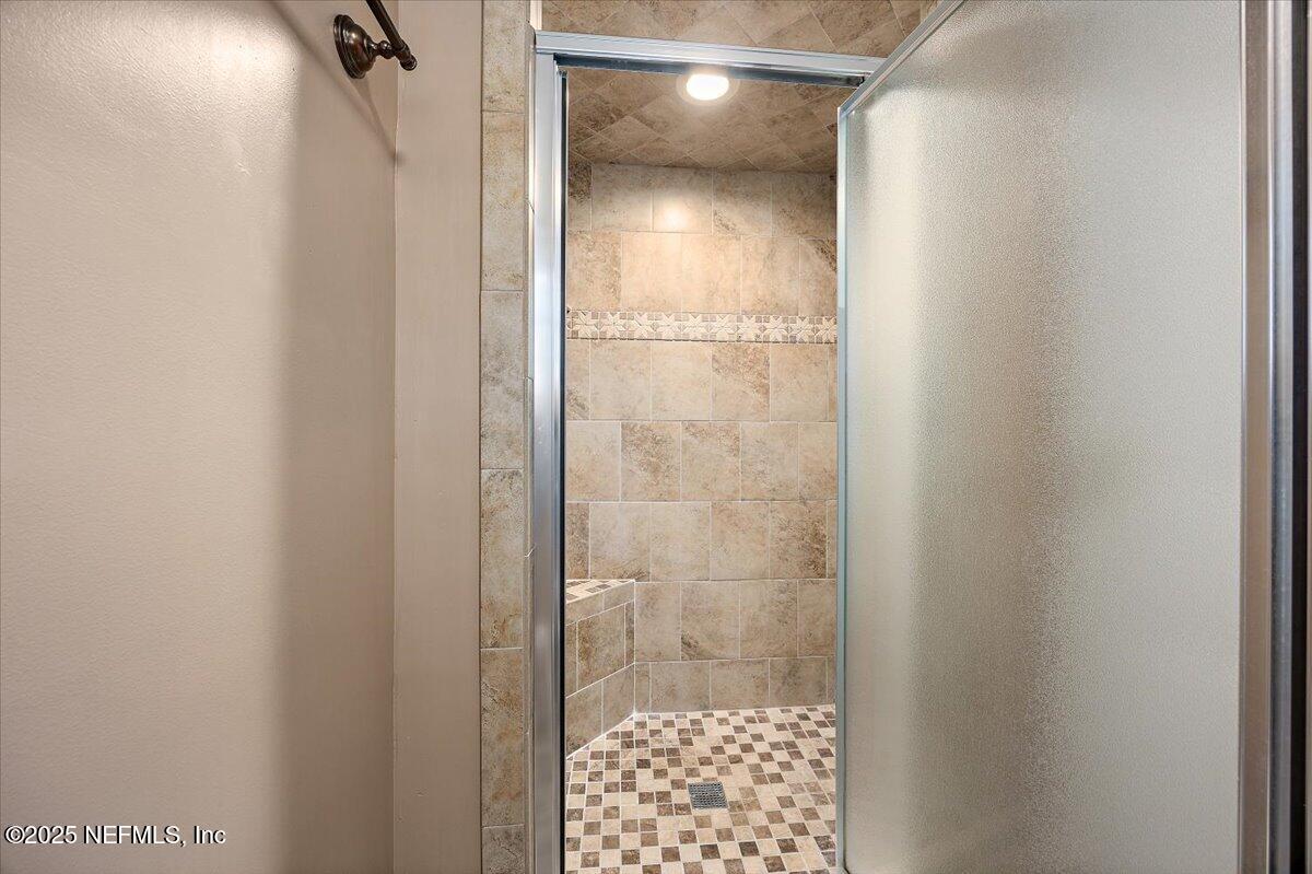 16361 Waterville Road, Unit 1 Jacksonville, FL 32226 - Photo 23 of 32 a bathroom with a glass shower door