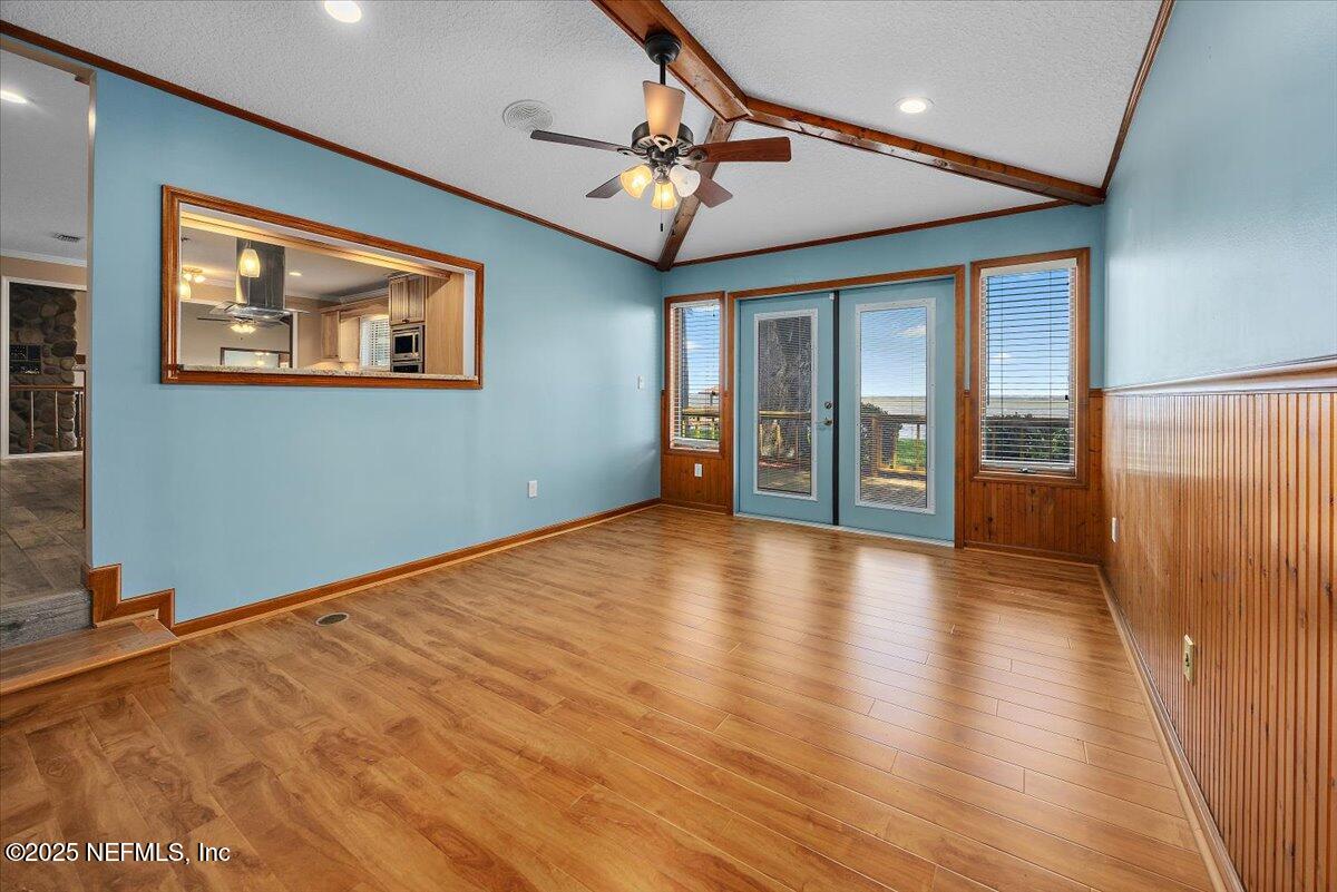 16361 Waterville Road, Unit 1 Jacksonville, FL 32226 - Photo 25 of 32 wooden floor in an empty room with a window