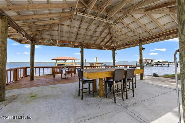 a patio with a table and chairs