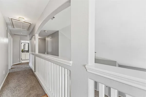 a view of a hallway with windows