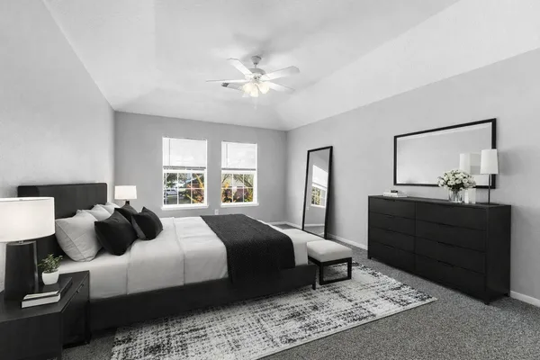 a bedroom with a bed and a dresser