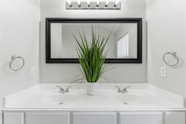 a bathroom with sink and mirror