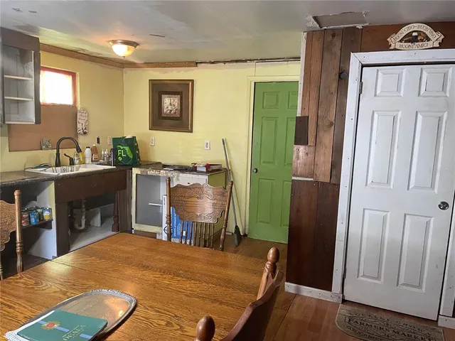 a workspace with furniture window and wooden floor