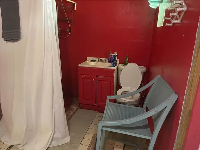 a room with furniture and wooden floor