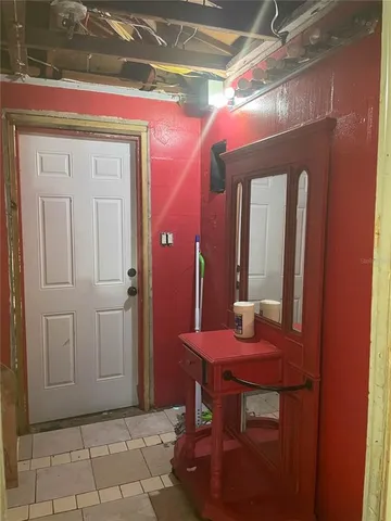 a dining room with table and chairs