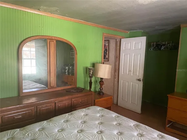 a view of livingroom with furniture and mirror