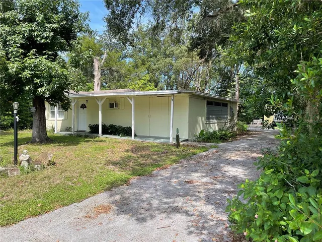 a house with trees in the background