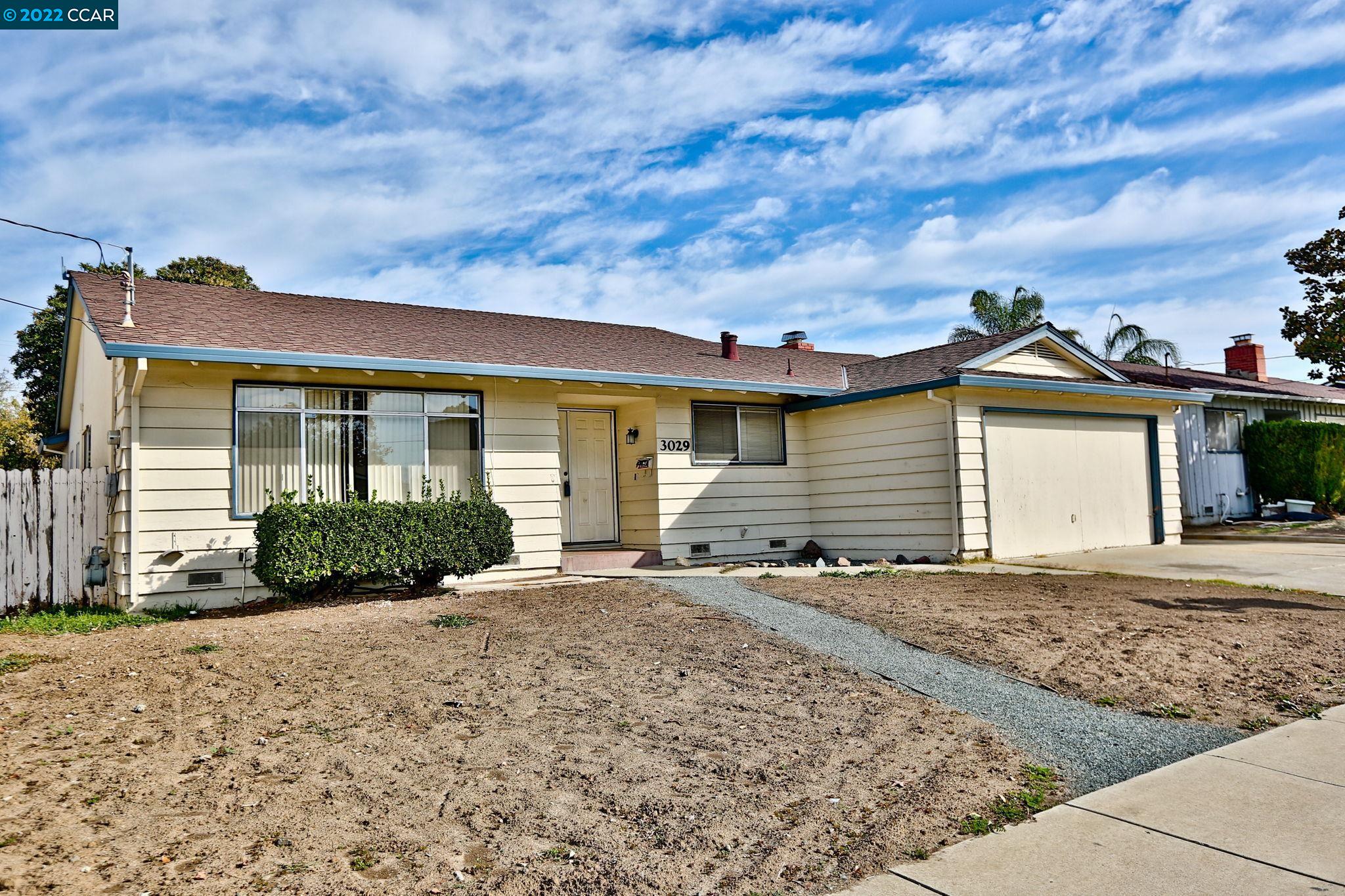 3029 Longview Road Antioch, CA 94509 - Photo 1 of 1 a front view of a house with a garden and pathway