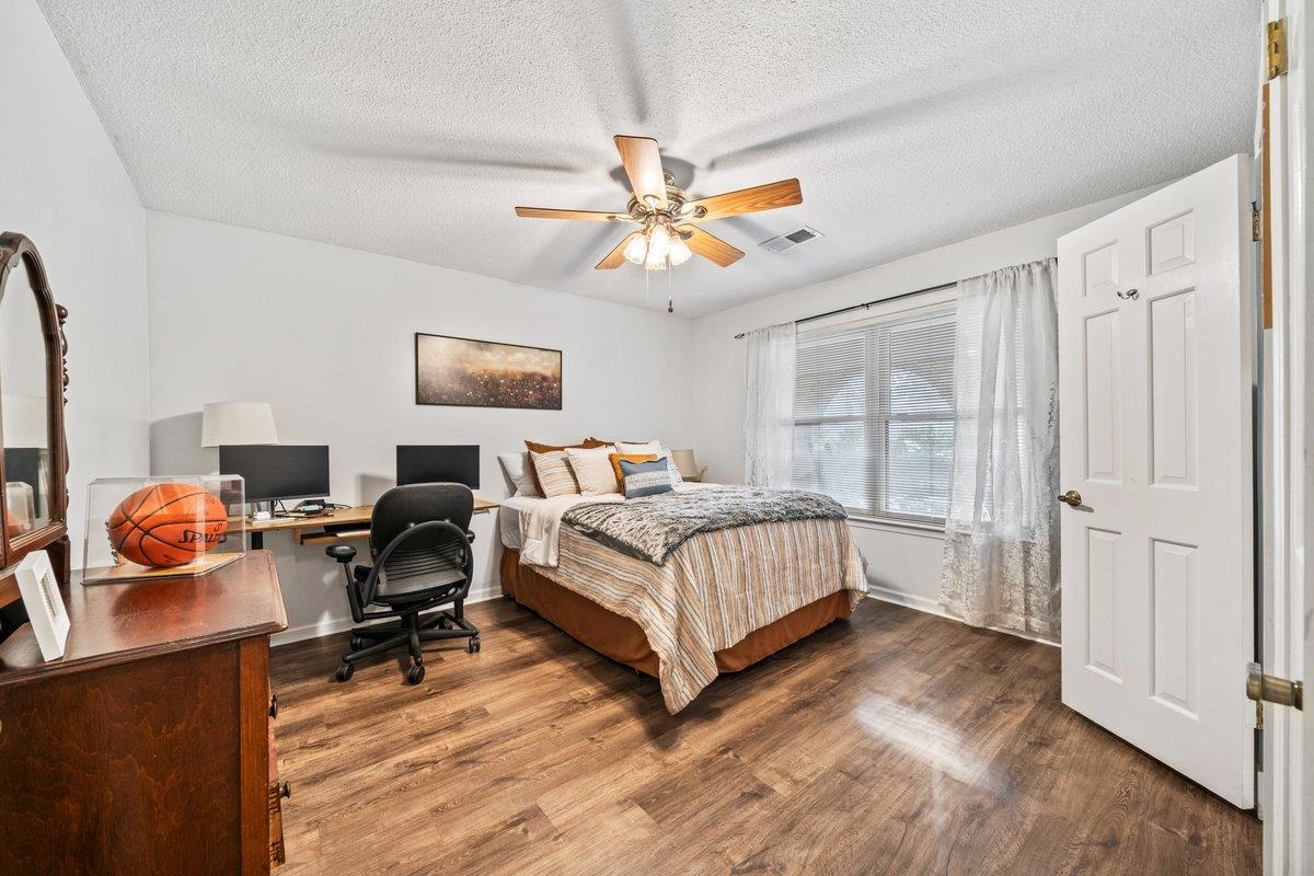 2135 Brierbrook Road Germantown, TN 38138 - Photo 15 of 25 Bedroom with a desk, dark wood finished floors, a textured ceiling, and a ceiling fan