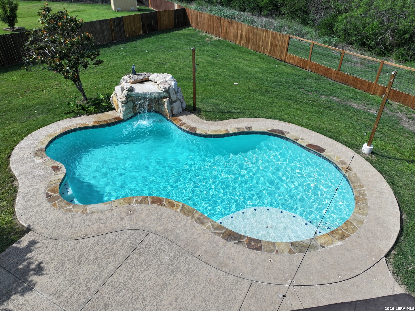 10111 Shallow Bank Converse, TX 78109 - Photo 56 of 65 a view of a swimming pool with a yard