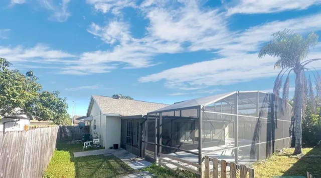 a view of backyard with tub