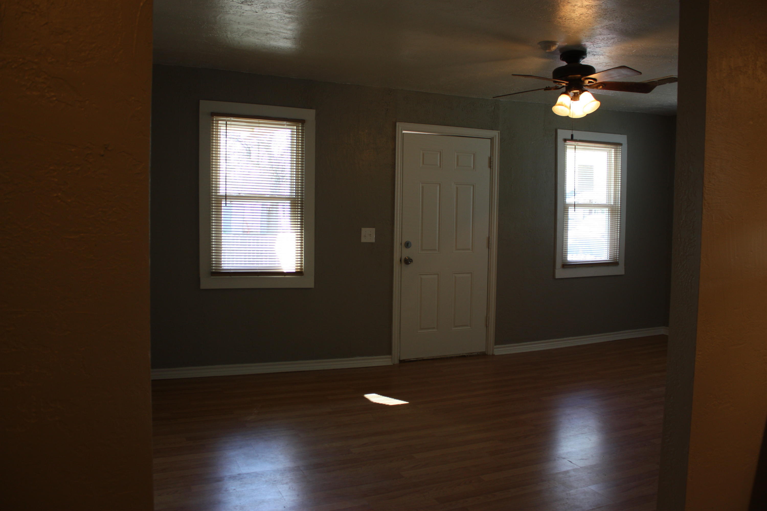 3905 South Tyler Street Amarillo, TX 79110 - Photo 11 of 35 a view of entryway and hall with wooden floor