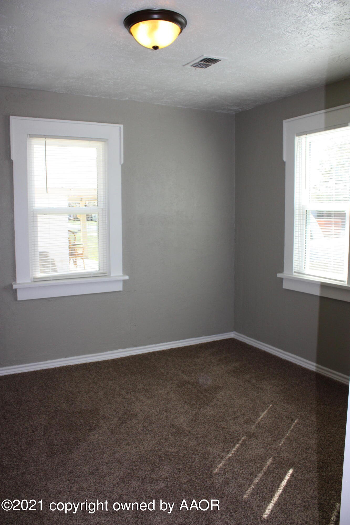 3905 South Tyler Street Amarillo, TX 79110 - Photo 15 of 35 an empty room with a window