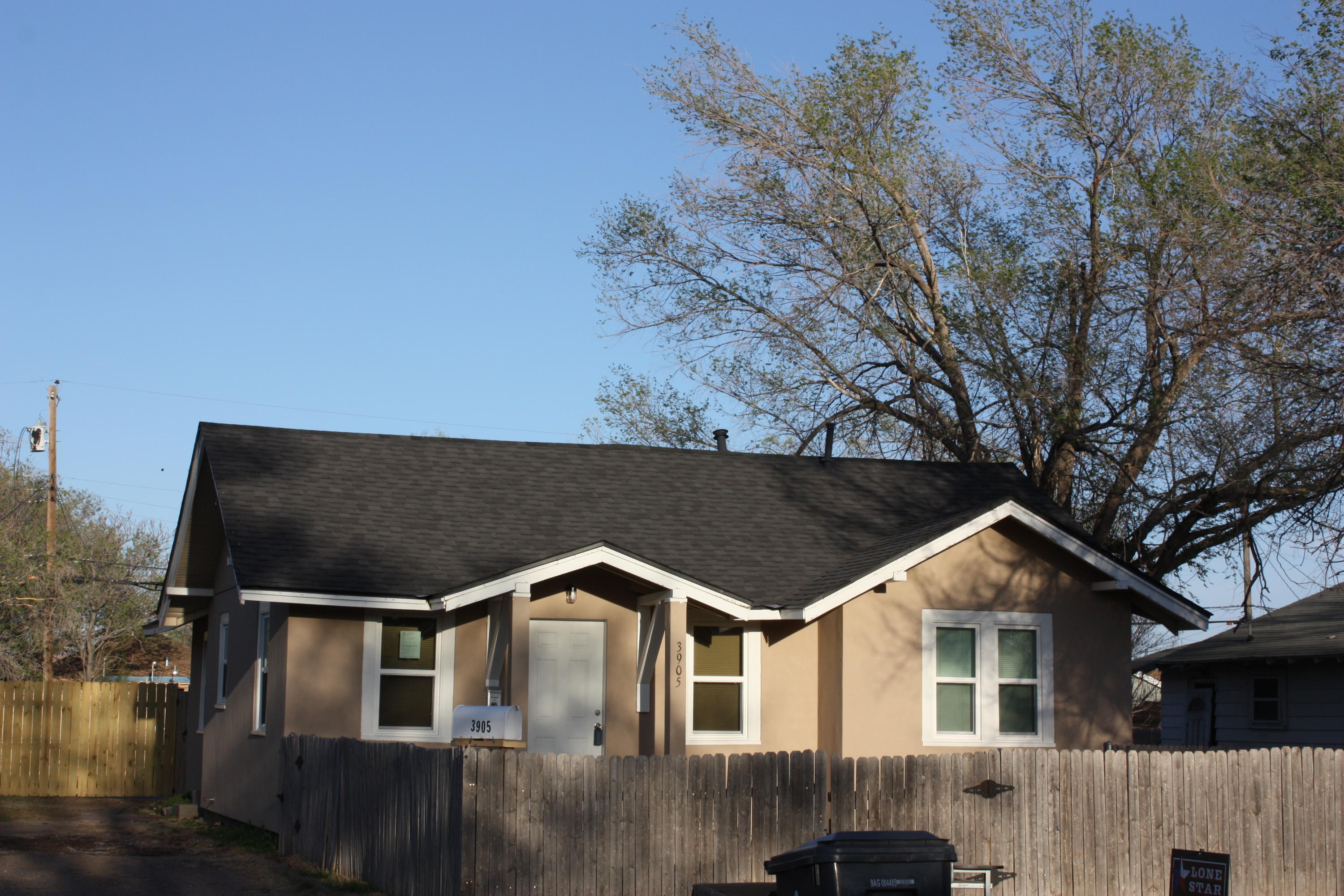 3905 South Tyler Street Amarillo, TX 79110 - Photo 2 of 35 a front view of a house with a yard