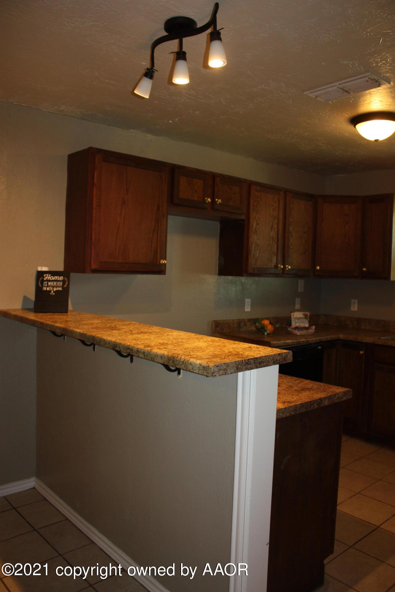 3905 South Tyler Street Amarillo, TX 79110 - Photo 21 of 35 a kitchen with stainless steel appliances granite countertop a refrigerator a sink and a stove