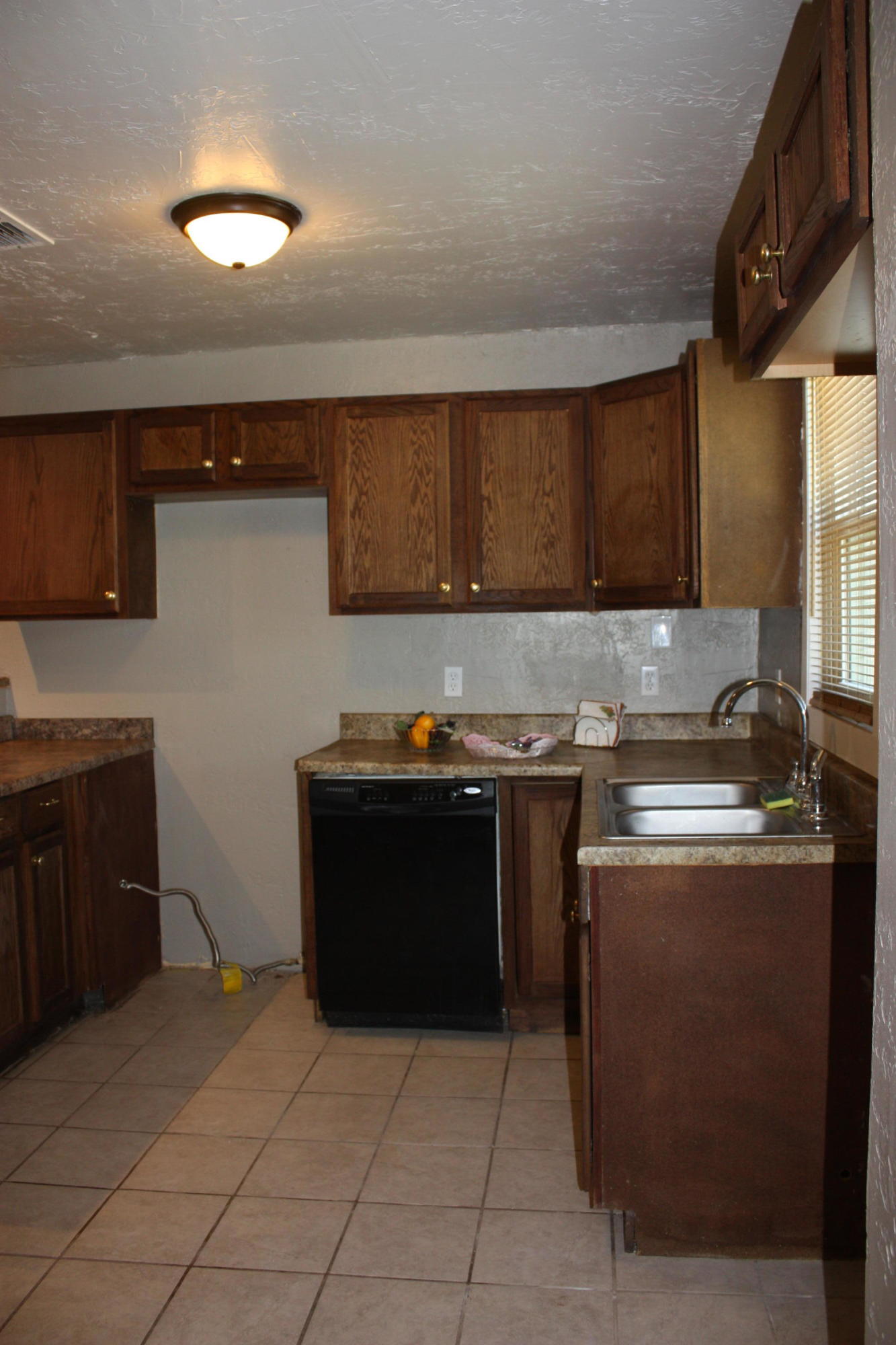 3905 South Tyler Street Amarillo, TX 79110 - Photo 23 of 35 a kitchen with stainless steel appliances granite countertop a stove a sink and a microwave