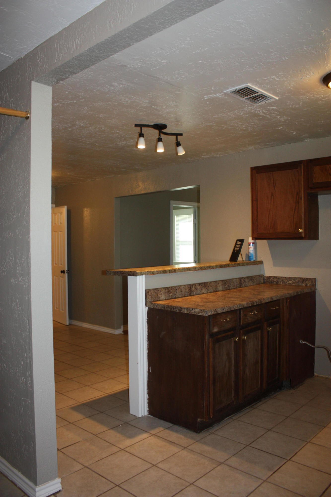 3905 South Tyler Street Amarillo, TX 79110 - Photo 25 of 35 a bathroom with a granite countertop sink and a mirror