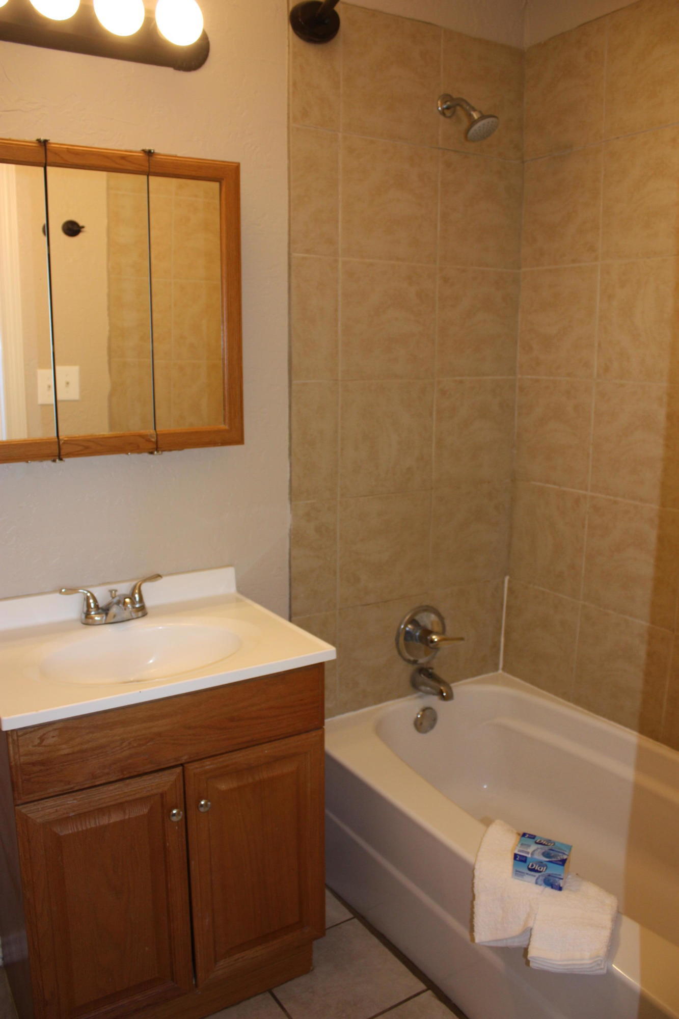 3905 South Tyler Street Amarillo, TX 79110 - Photo 32 of 35 a bathroom with a sink a vanity and a bathtub
