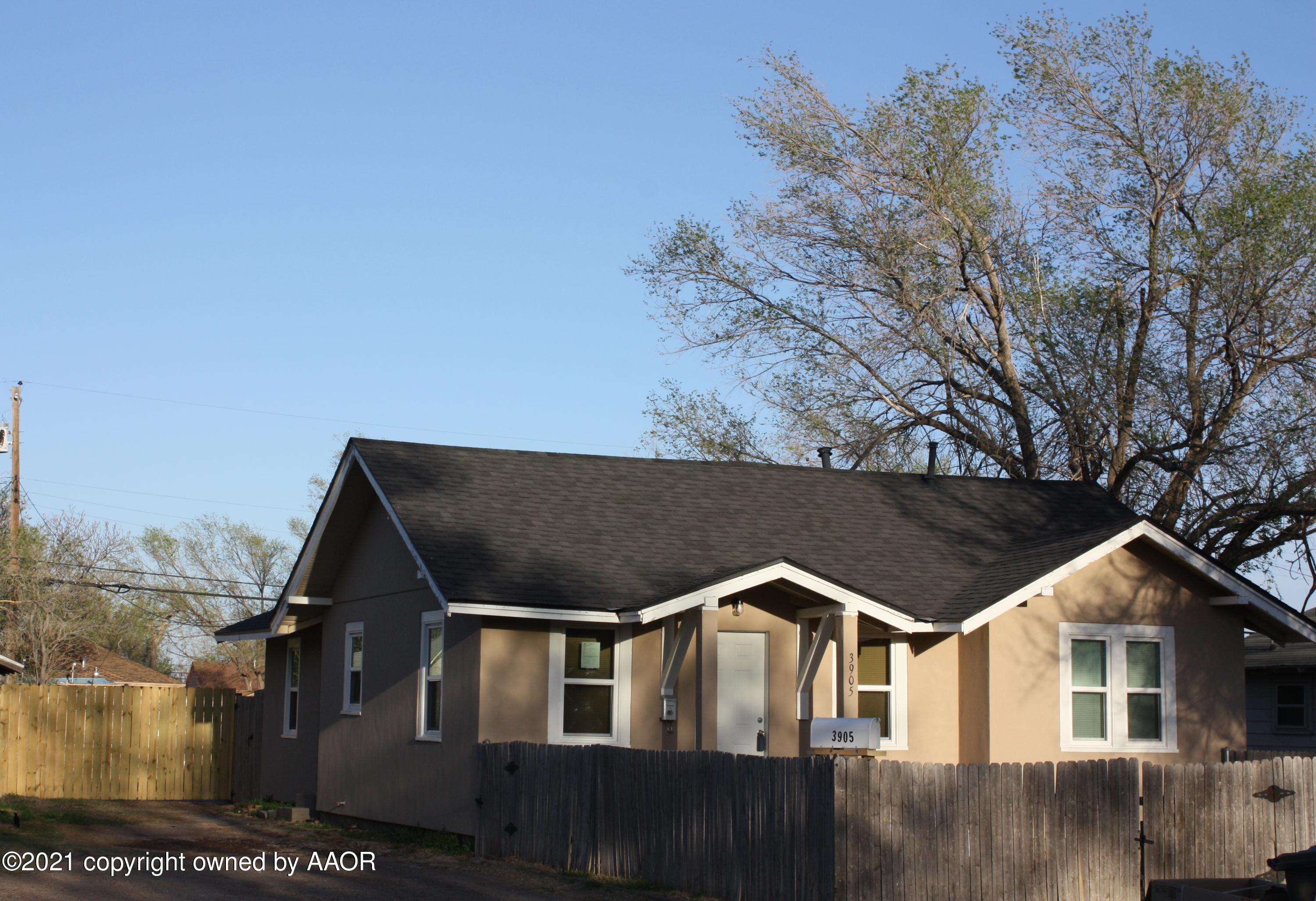 3905 South Tyler Street Amarillo, TX 79110 - Photo 5 of 35 a front view of a house with a yard