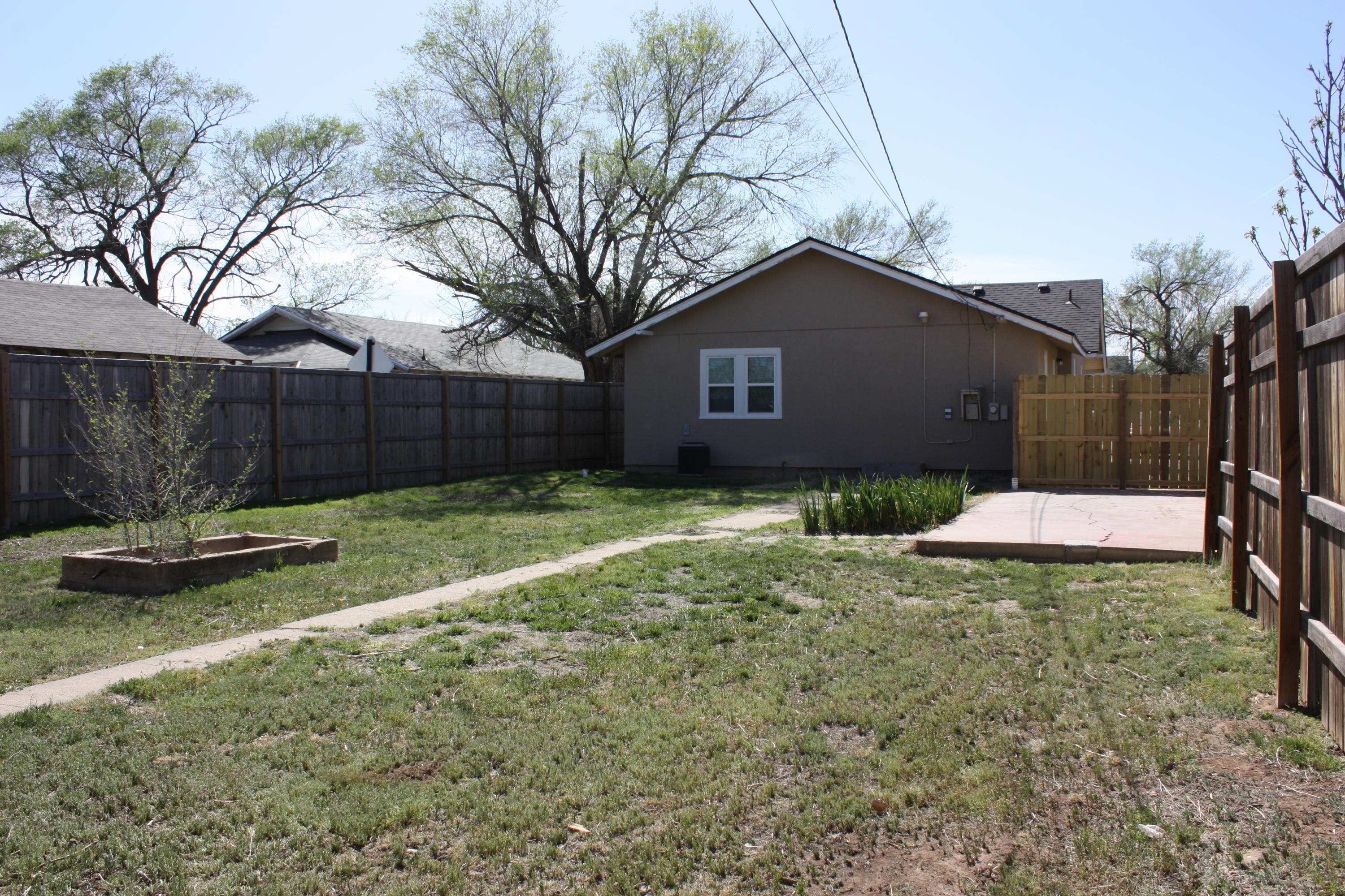 3905 South Tyler Street Amarillo, TX 79110 - Photo 8 of 35 a backyard of a house
