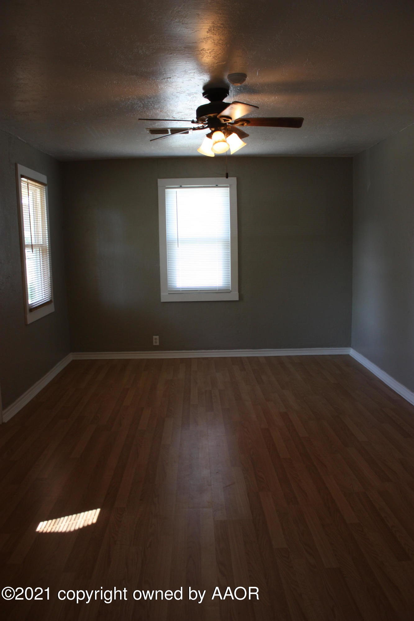 3905 South Tyler Street Amarillo, TX 79110 - Photo 10 of 35 a view of wooden floor and windows in a room