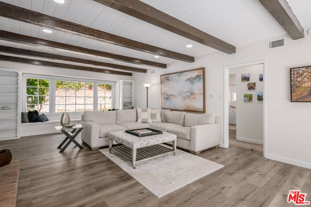 2841 Roscomare Road Los Angeles, CA 90077 - Photo 1 of 28 a living room with furniture and wooden floor