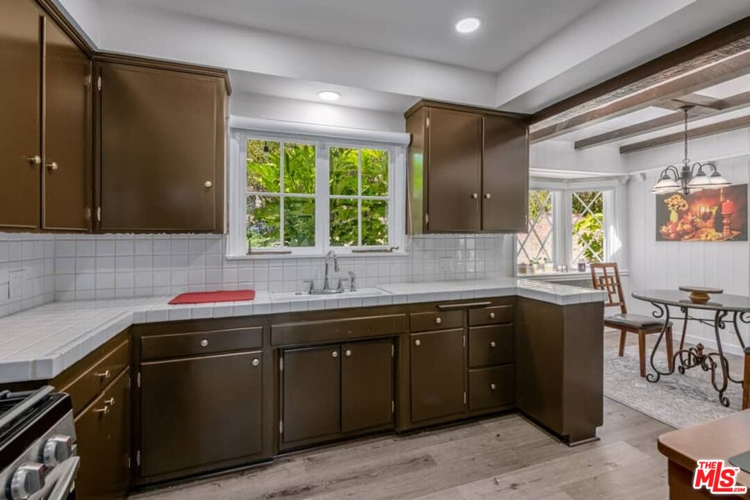 2841 Roscomare Road Los Angeles, CA 90077 - Photo 12 of 28 a kitchen with a sink and cabinets