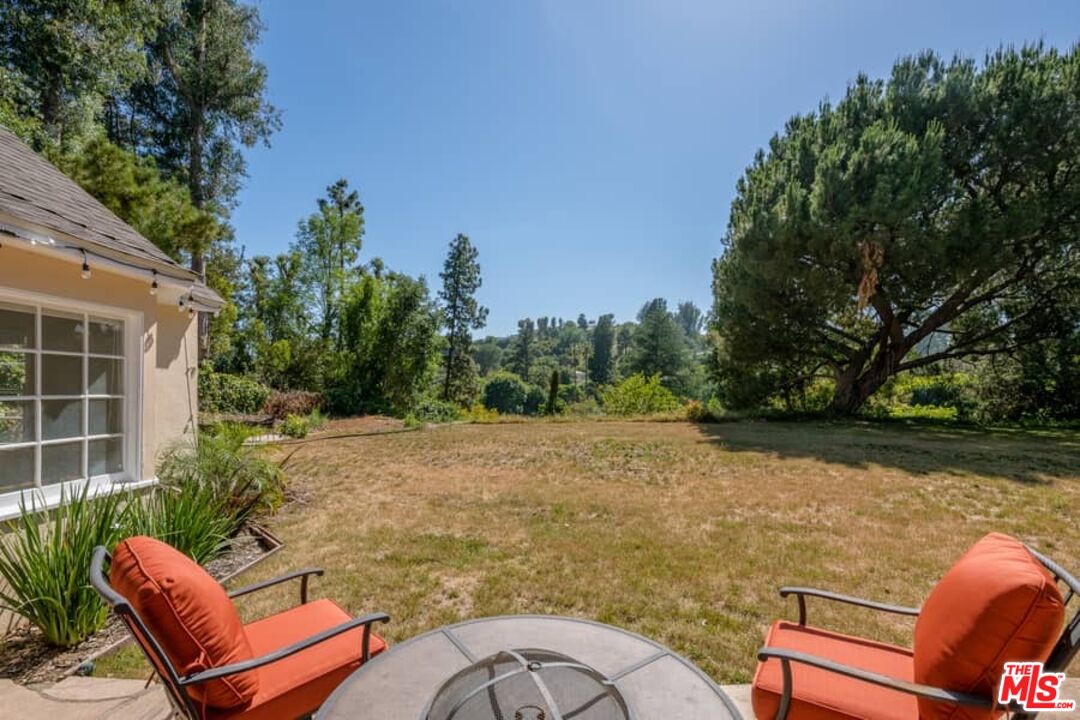 2841 Roscomare Road Los Angeles, CA 90077 - Photo 28 of 28 a view of a backyard with furniture