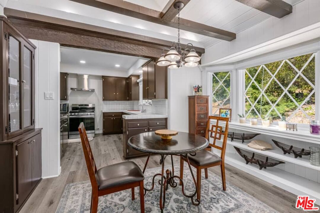 2841 Roscomare Road Los Angeles, CA 90077 - Photo 9 of 28 a view of a dining room with furniture window and outside view