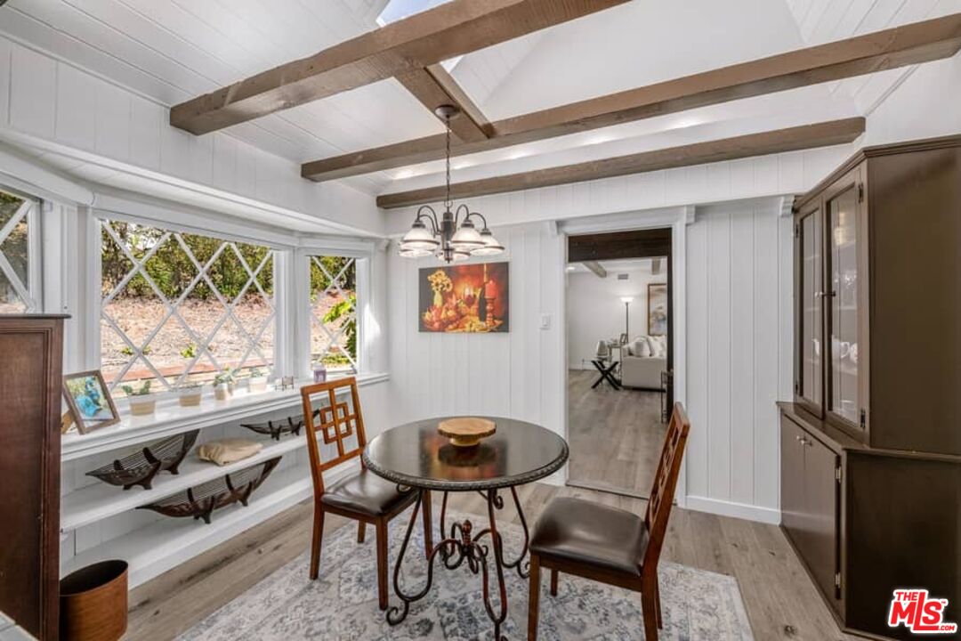 2841 Roscomare Road Los Angeles, CA 90077 - Photo 10 of 28 a view of a dining room with furniture window and outside view