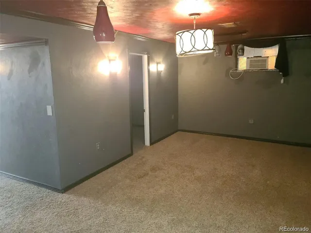 en empty room with windows and yard