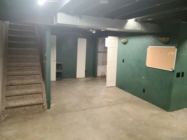 a view of a hallway with stairs