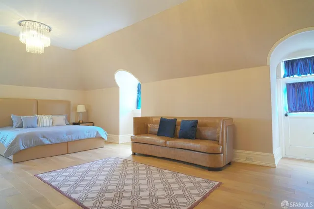 view of a hallway with wooden floor windows and cabinet