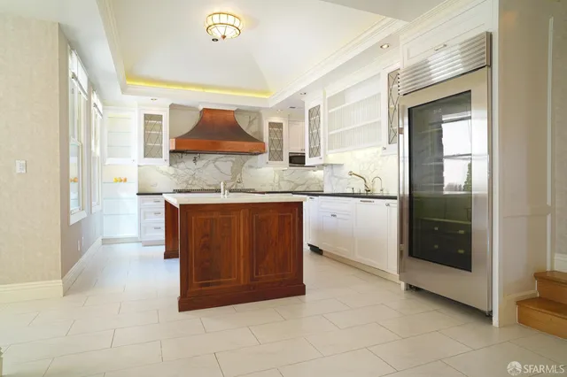 a kitchen with stainless steel appliances granite countertop a sink and cabinets