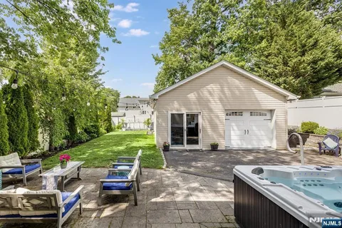 a backyard of a house with yard and outdoor seating