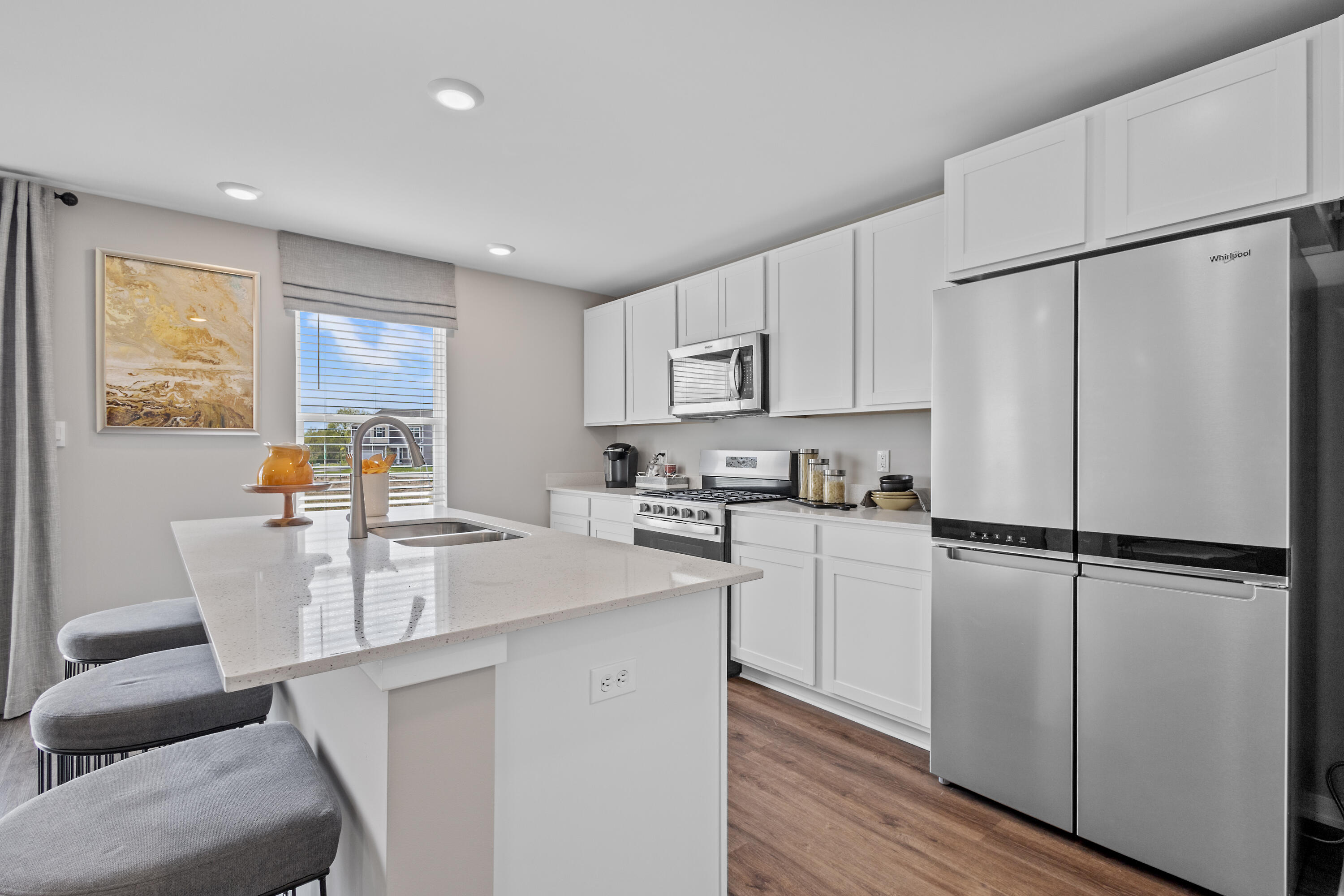 4187 Viceroy Street Portage, IN 46368 - Photo 8 of 34 a kitchen with white cabinets and white appliances
